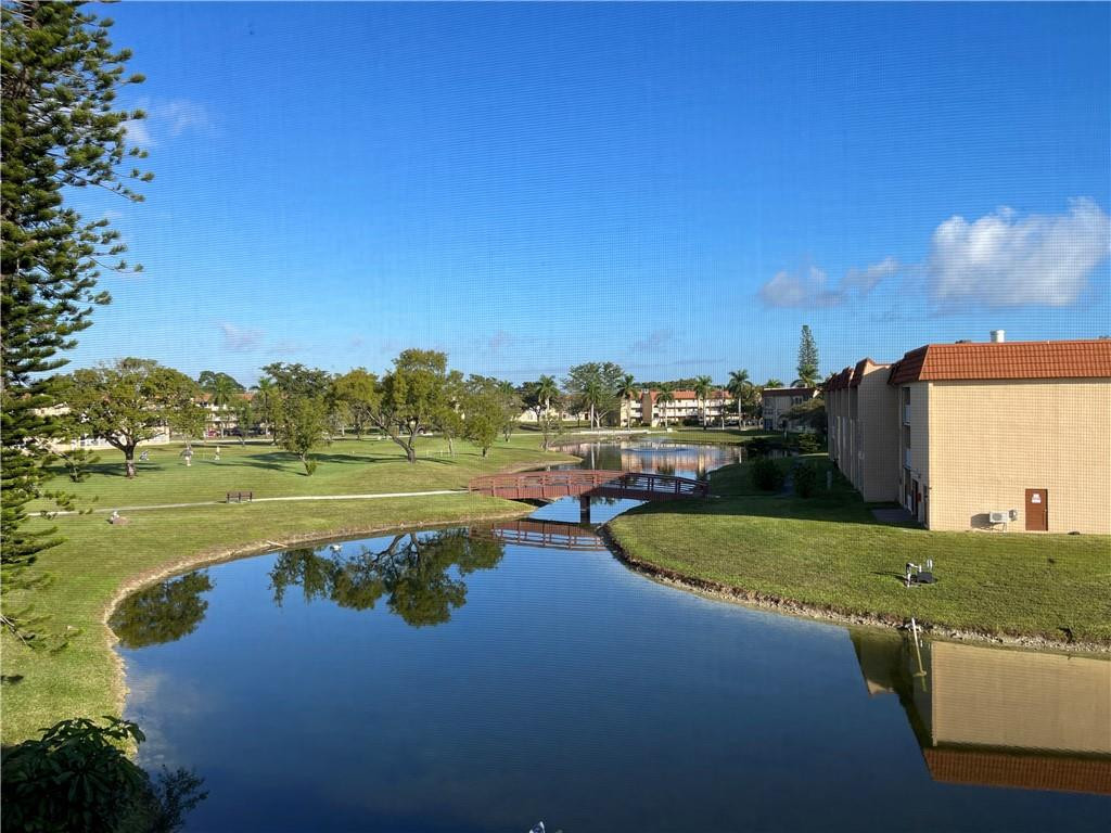 2781 North Pine Island Road, Unit 308 Sunrise, FL 33322 - Photo 5 of 16 a view of a lake with a house