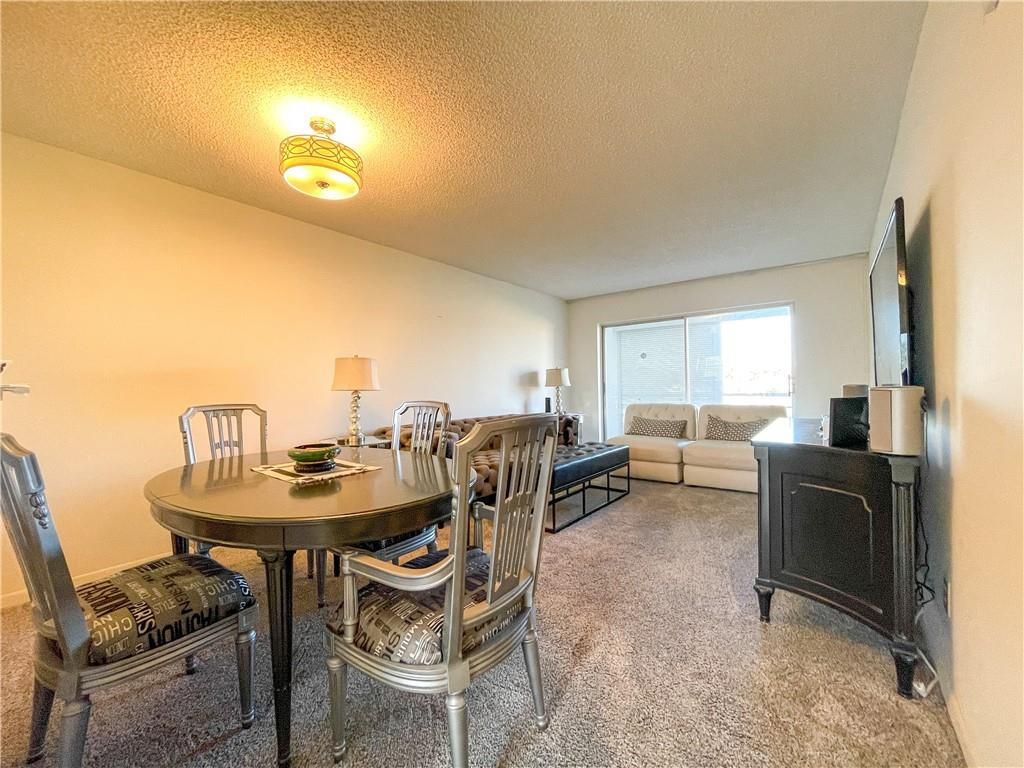 2781 North Pine Island Road, Unit 308 Sunrise, FL 33322 - Photo 9 of 16 a view of a dining room with furniture and a window