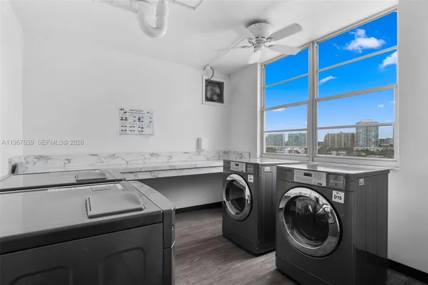 a kitchen with a sink a washer and dryer