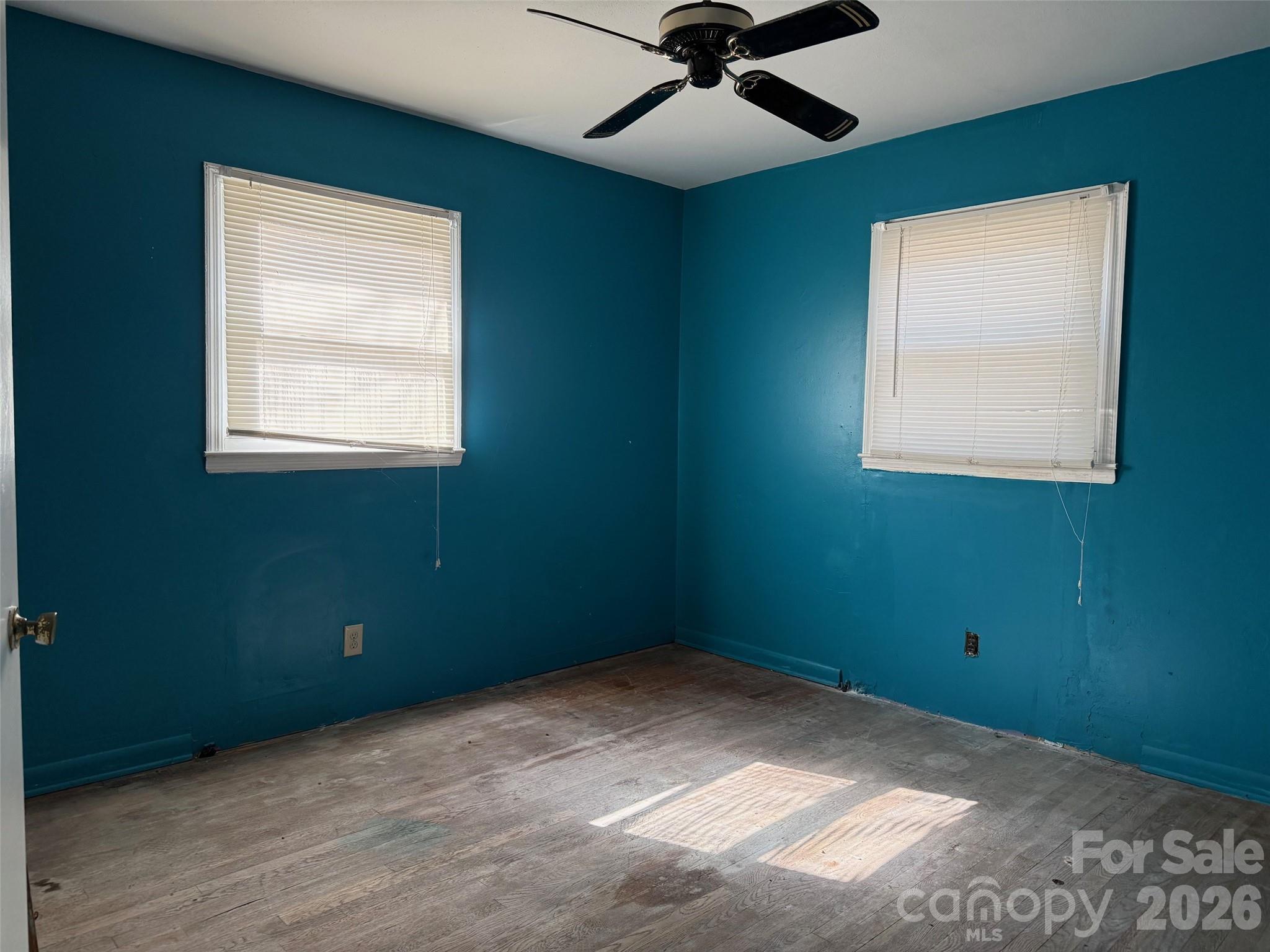 427 Clinton Avenue Lancaster, SC 29720 - Photo 6 of 7 an empty room with a window and a fan