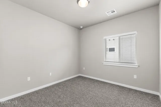 a view of a bathroom from a hallway