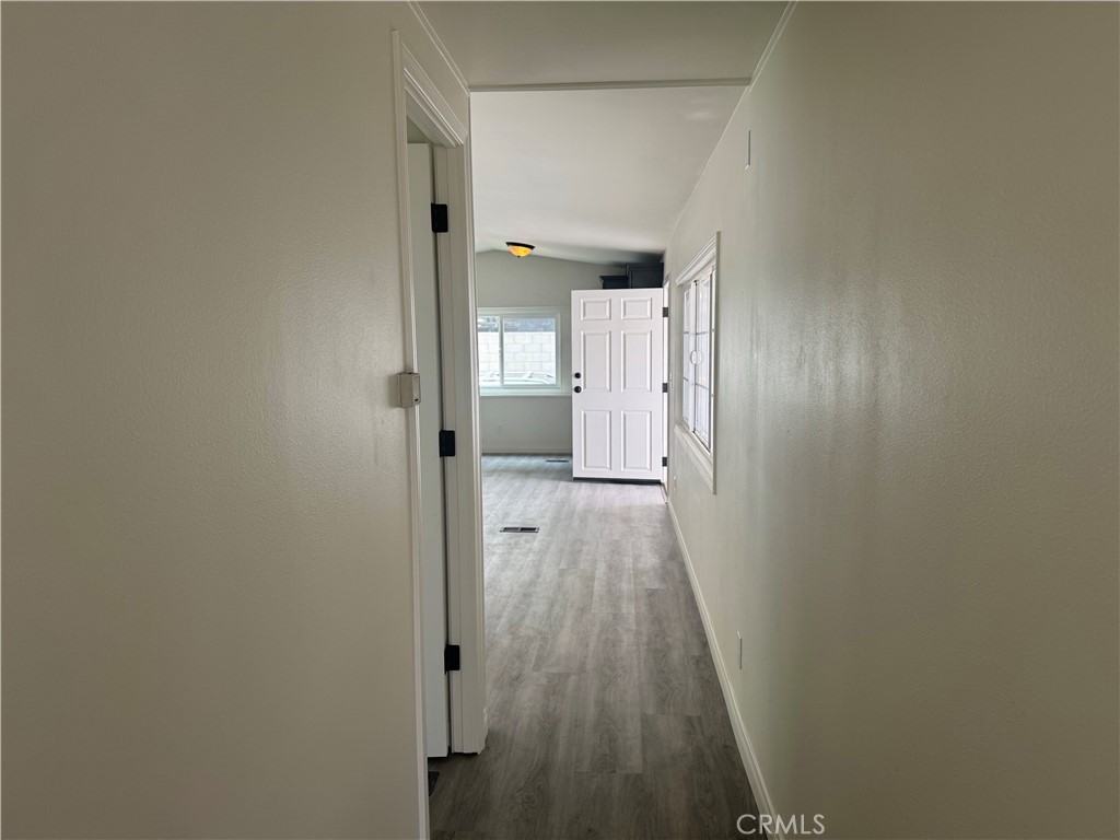715 West 220th Street, Unit 47 Torrance, CA 90502 - Photo 13 of 15 a view of a hallway with wooden floor