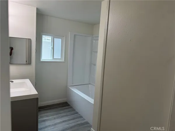 a bathroom with a sink and a bathtub
