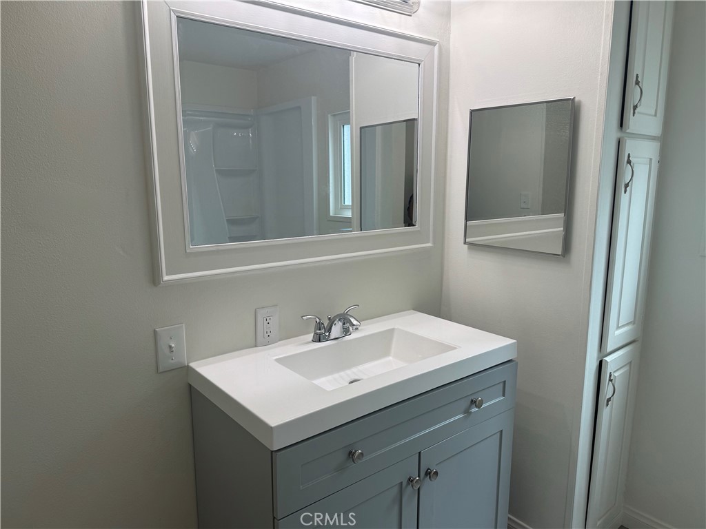 715 West 220th Street, Unit 47 Torrance, CA 90502 - Photo 7 of 15 a bathroom with 2 sink and a mirror