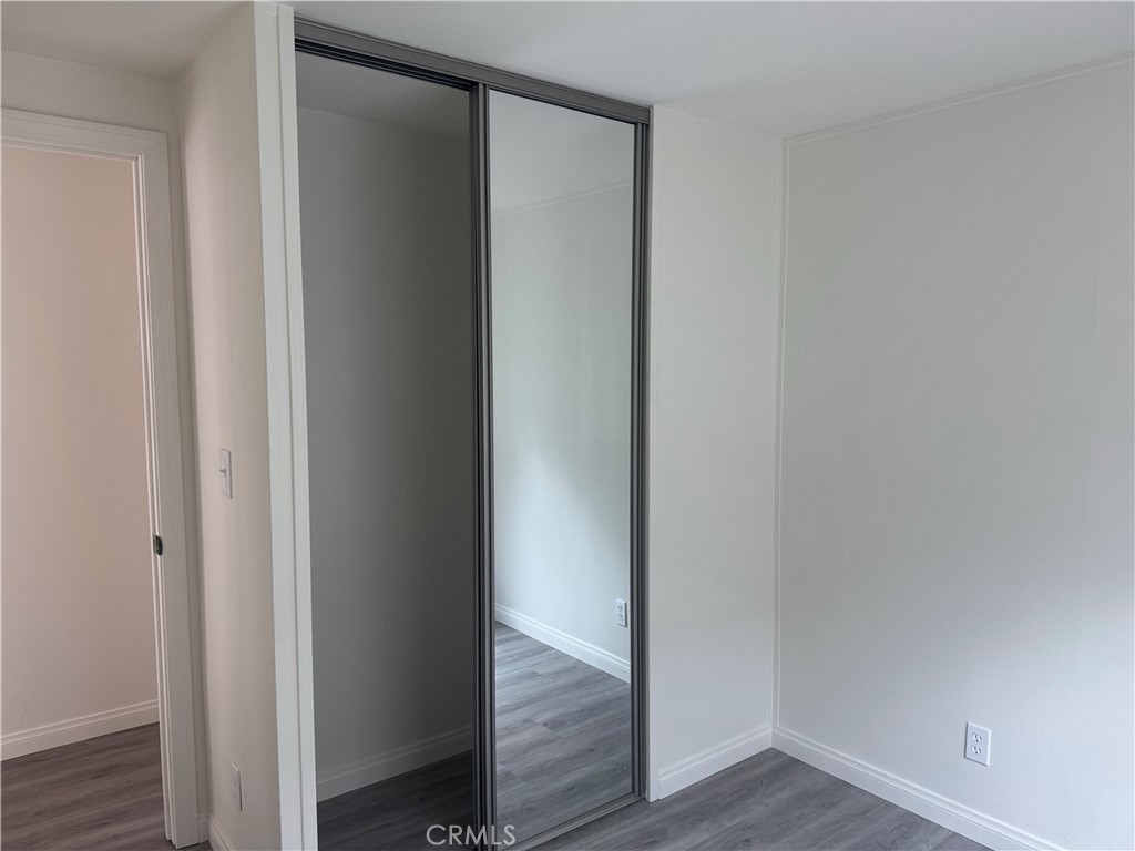 715 West 220th Street, Unit 47 Torrance, CA 90502 - Photo 8 of 15 a view of empty room with wooden floor
