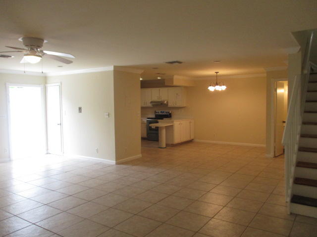 9370 Southwest 61st Way, Unit 15D Boca Raton, FL 33428 - Photo 3 of 16 a view of a kitchen with a sink and a refrigerator