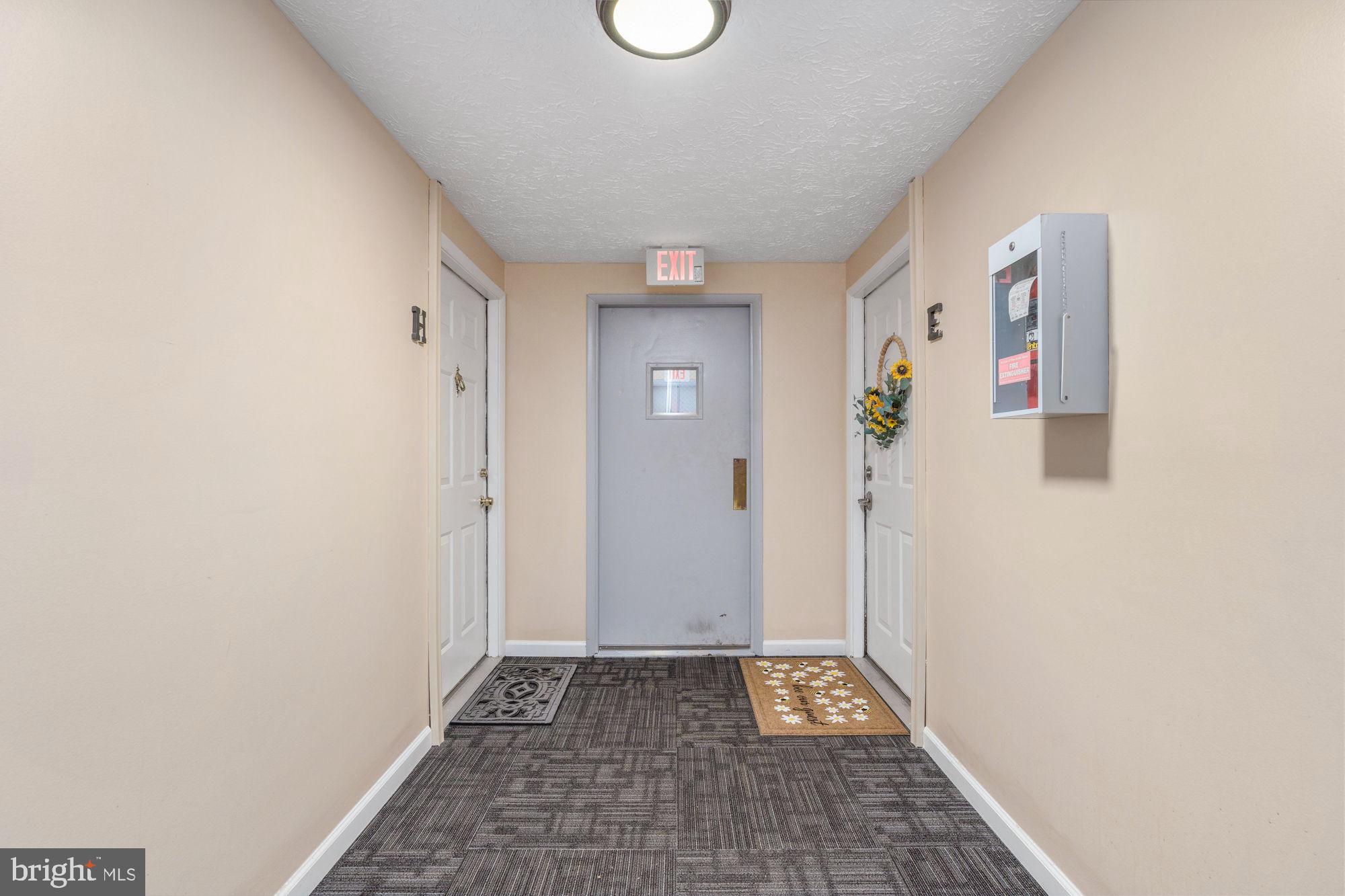 4420 Groombridge Way, Unit 4420E Alexandria, VA 22309 - Photo 4 of 39 Secondary secure entrance to outdoor walking trail