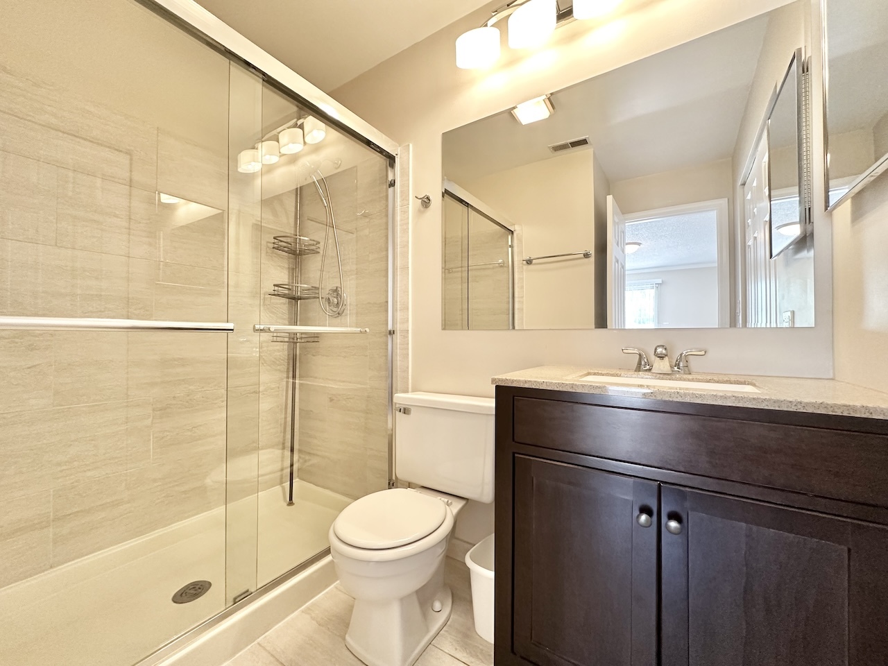 1193 Ranchview Court Buffalo Grove, IL 60089 - Photo 13 of 19 a bathroom with a sink a toilet and shower
