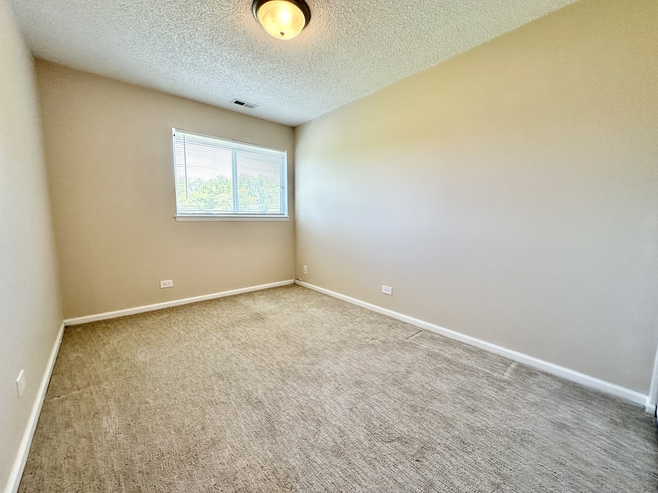 1193 Ranchview Court Buffalo Grove, IL 60089 - Photo 14 of 19 an empty room with a window