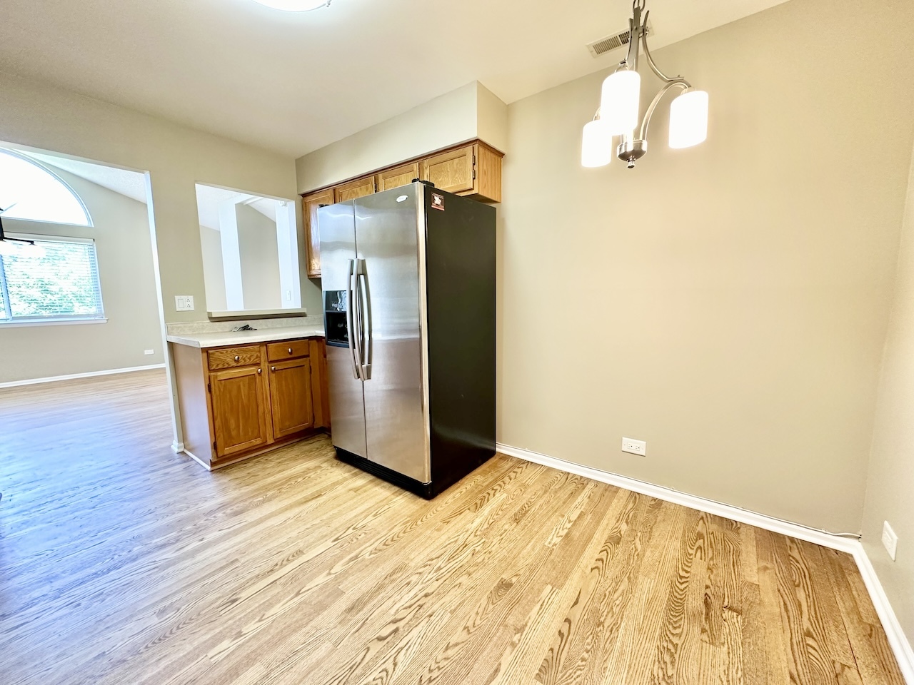 1193 Ranchview Court Buffalo Grove, IL 60089 - Photo 5 of 19 a view of a kitchen with wooden floor a sink and dishwasher
