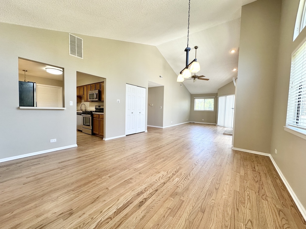 1193 Ranchview Court Buffalo Grove, IL 60089 - Photo 6 of 19 a view of a room with wooden floor and windows