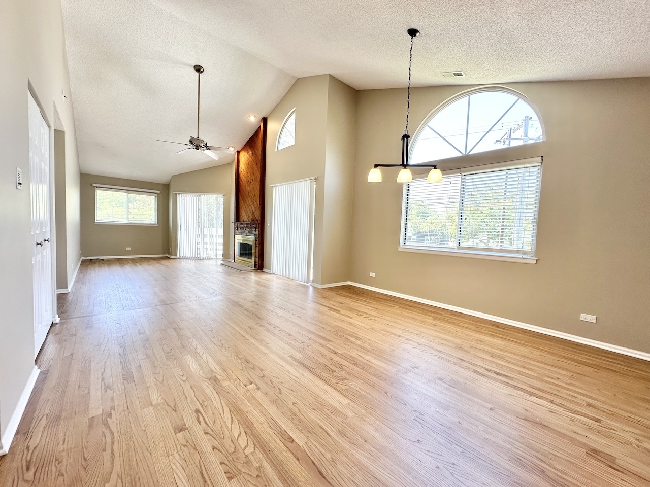 1193 Ranchview Court Buffalo Grove, IL 60089 - Photo 7 of 19 a view of an empty room with wooden floor and a window