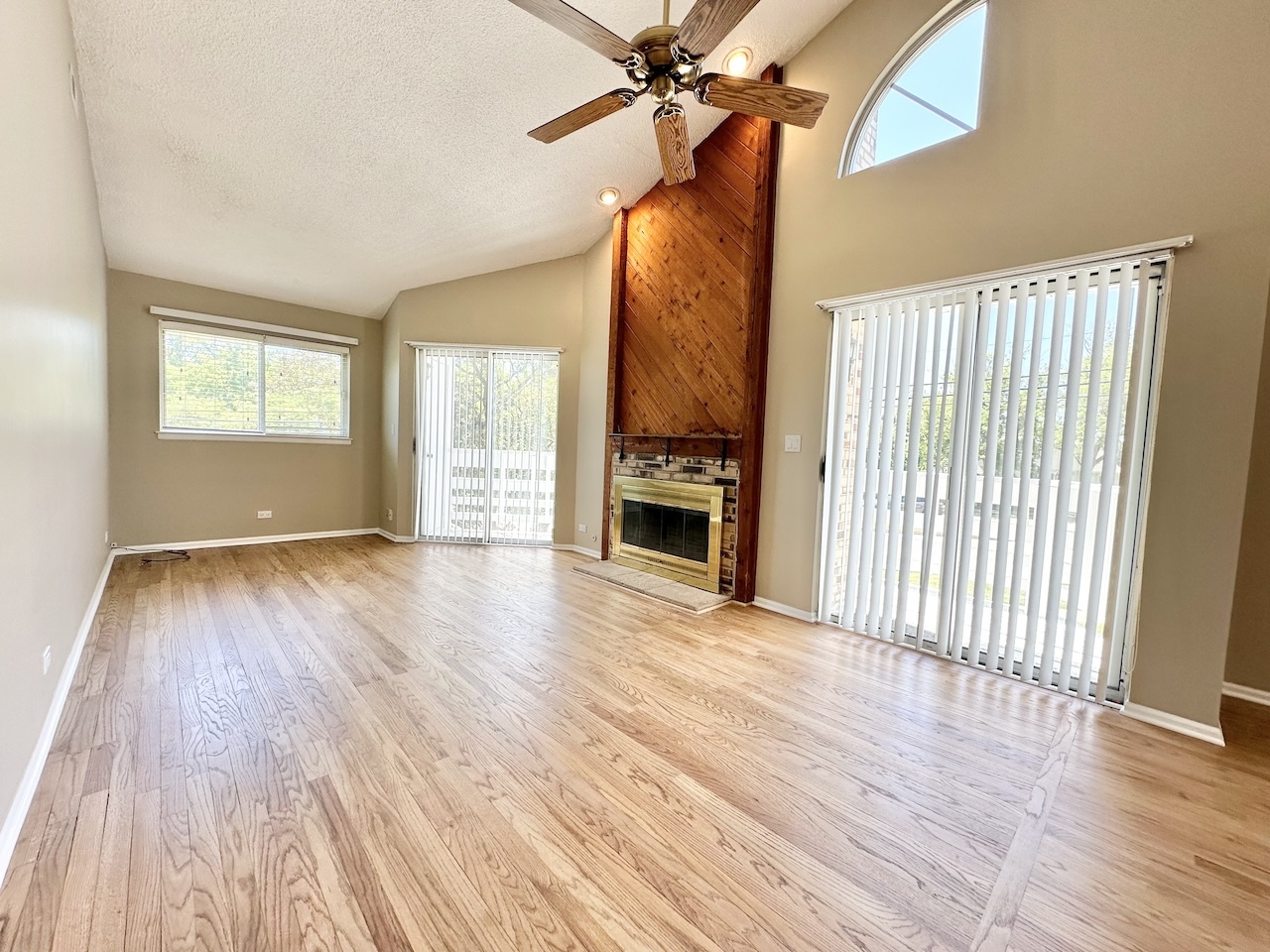 1193 Ranchview Court Buffalo Grove, IL 60089 - Photo 8 of 19 wooden floor in an empty room with a window