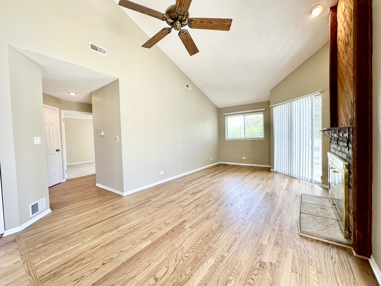 1193 Ranchview Court Buffalo Grove, IL 60089 - Photo 9 of 19 a view of an empty room with wooden floor and a window