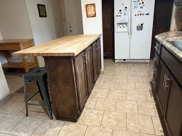 a bedroom with a bed and a rug