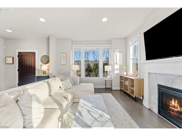 a kitchen with granite countertop a sink a stove and cabinets