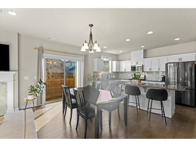 a living room with a fireplace and a flat screen tv