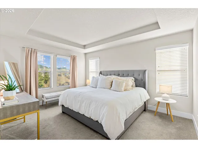 a view of walk in closet with clothes