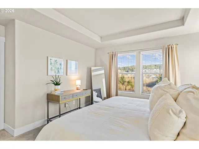 a bathroom with a granite countertop sink a mirror and shower