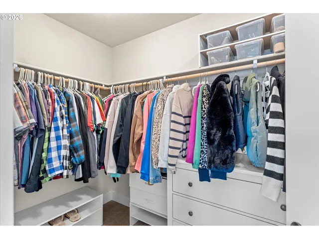a spacious bathroom with a double vanity sink mirror and shower