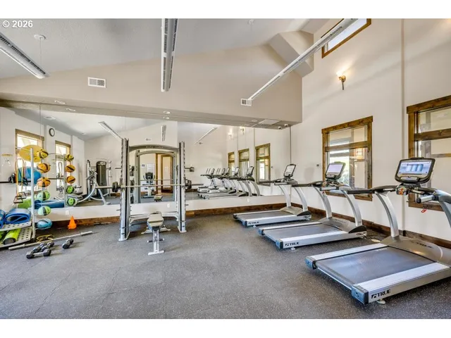 a living room with fireplace furniture and a flat screen tv