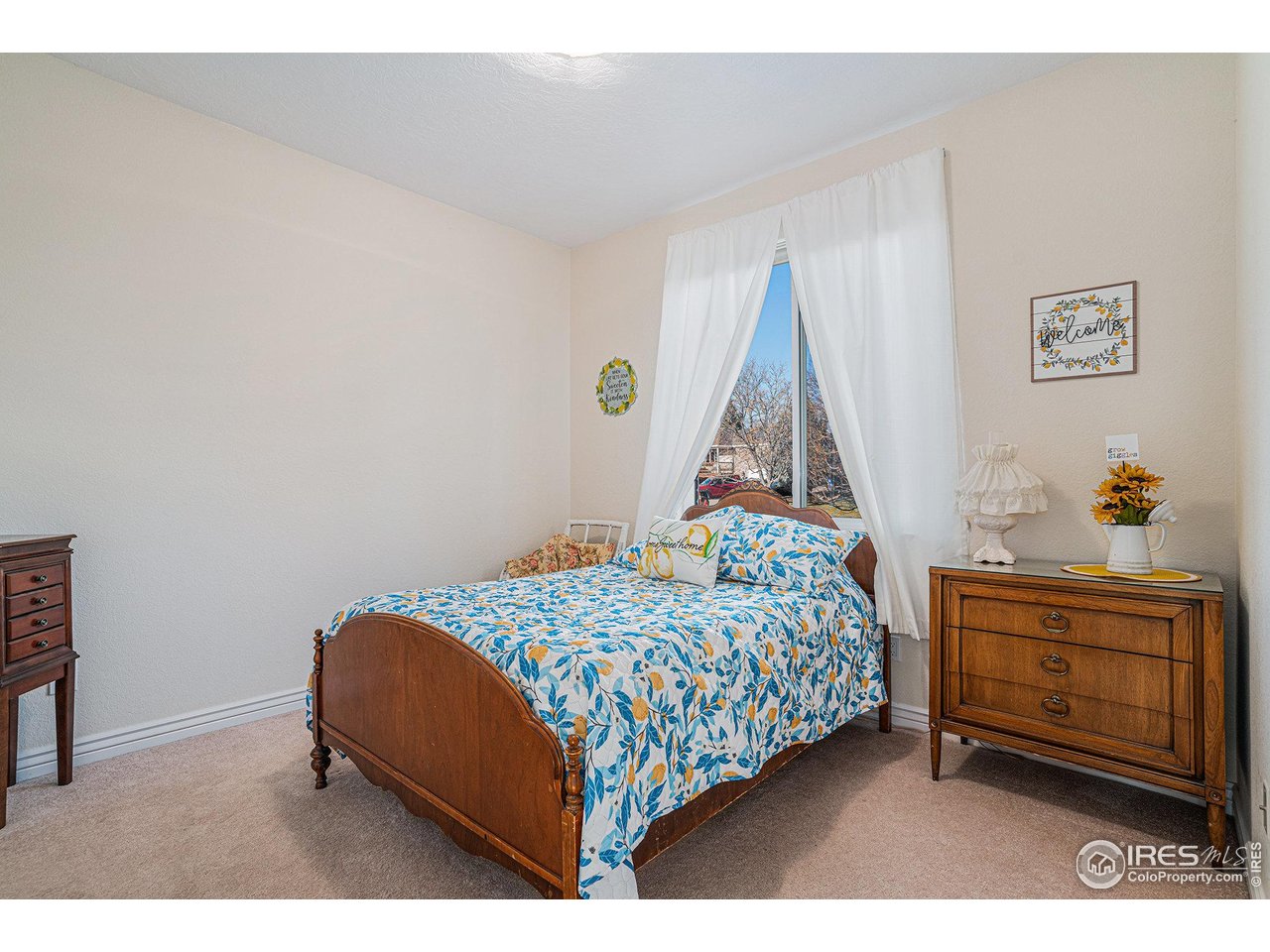 4402 30th Street Greeley, CO 80634 - Photo 17 of 31 a bedroom with a bed and a window