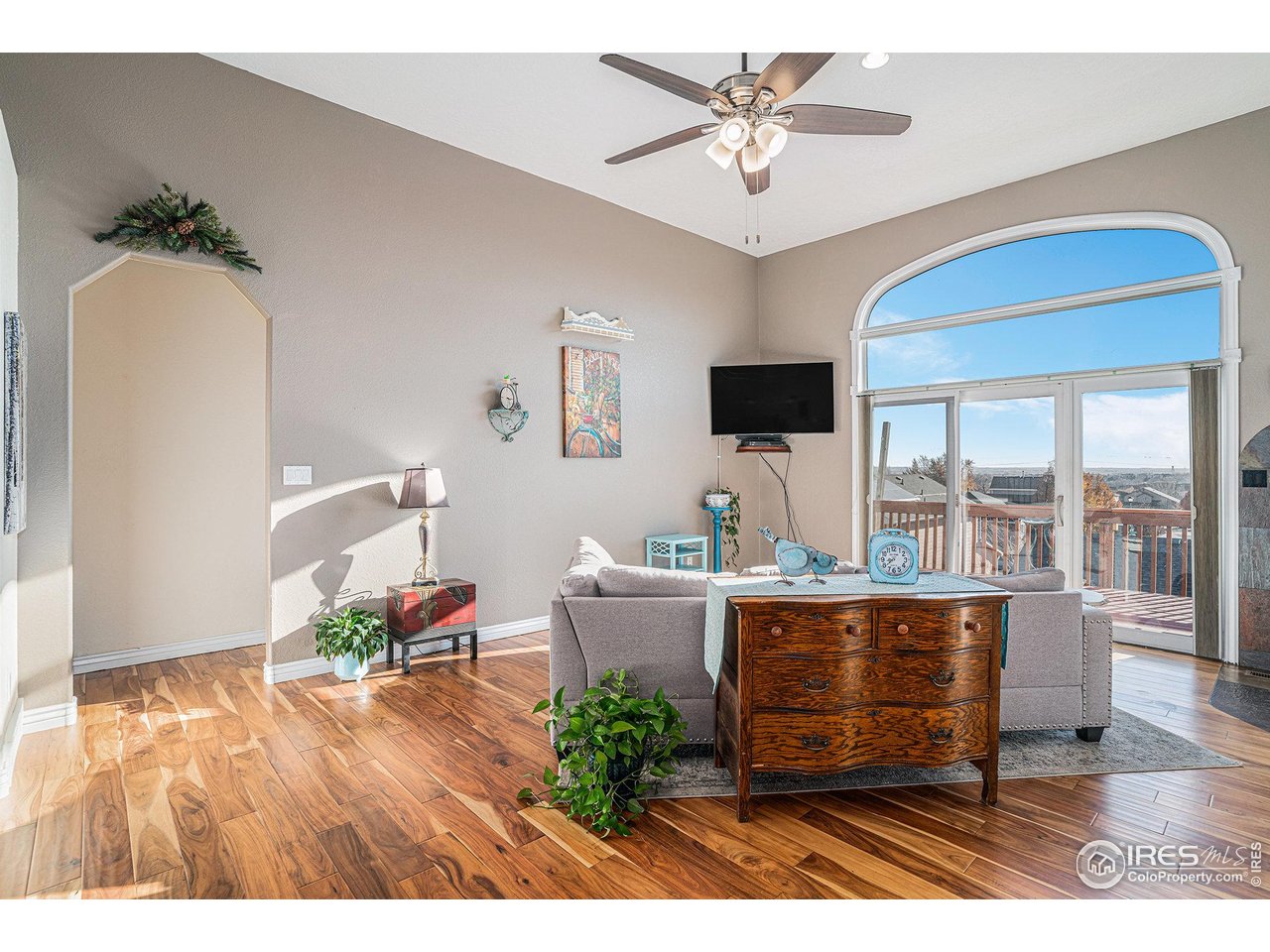 4402 30th Street Greeley, CO 80634 - Photo 5 of 31 a living room with furniture and a flat screen tv