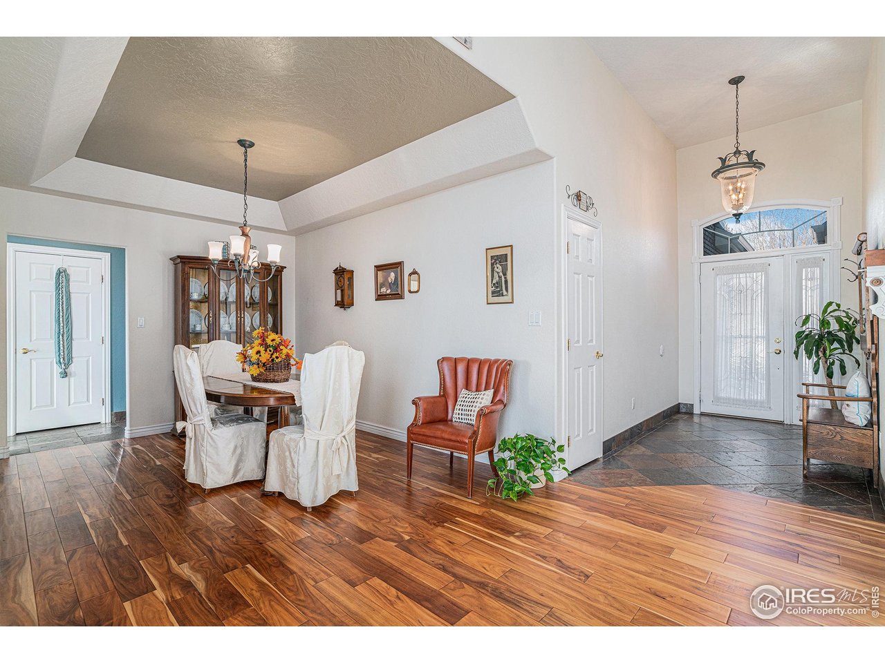 4402 30th Street Greeley, CO 80634 - Photo 8 of 31 a view of a dining room with furniture and wooden floor
