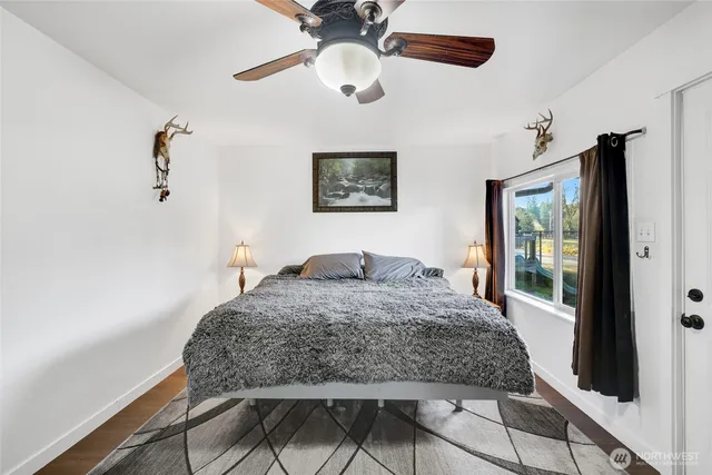 a living room with a bed furniture and a window
