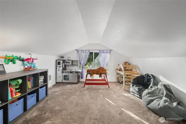 a bedroom with furniture and a book shelf