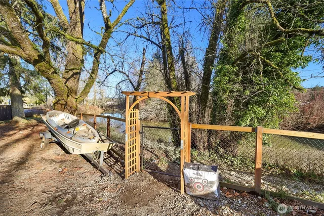 a view of a swimming pool with an outdoor space and seating area