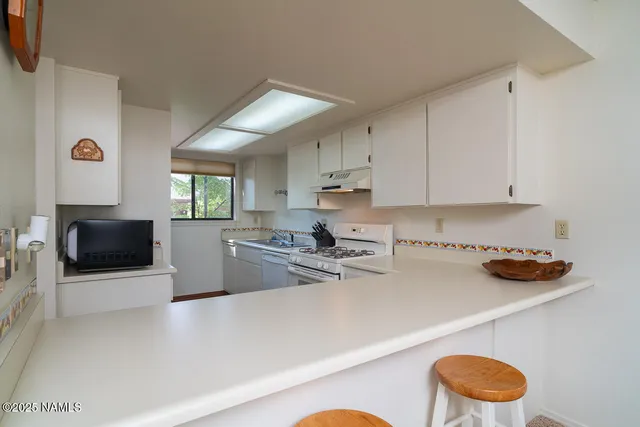 a bedroom with a bed and a television in it