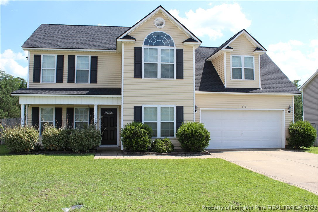678 Cape Fear Road Raeford, NC 28376 - Photo 1 of 30 a front view of a house with a yard