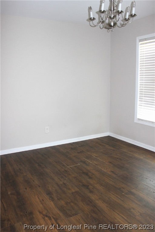 678 Cape Fear Road Raeford, NC 28376 - Photo 12 of 30 an empty room with wooden floor and windows