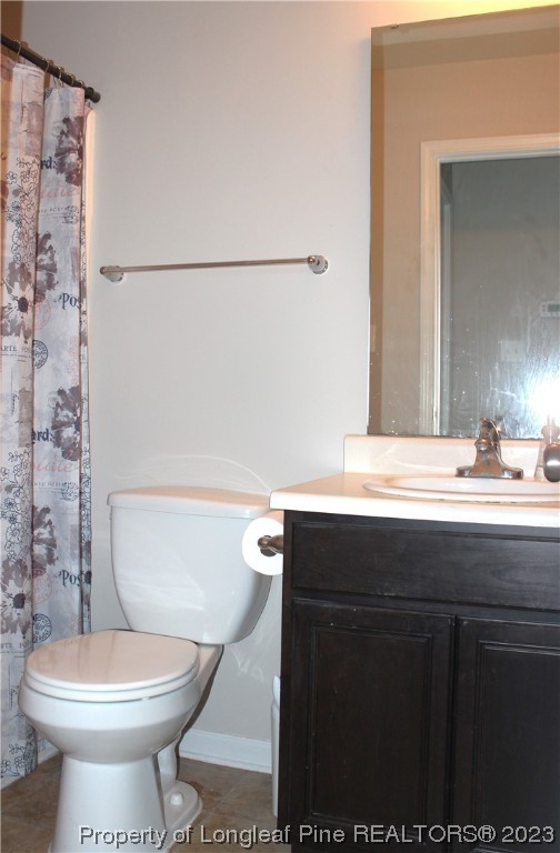678 Cape Fear Road Raeford, NC 28376 - Photo 17 of 30 a bathroom with a sink toilet and shower