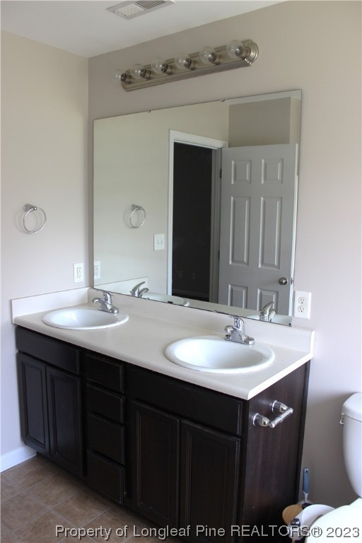 678 Cape Fear Road Raeford, NC 28376 - Photo 23 of 30 a bathroom with a sink and a mirror