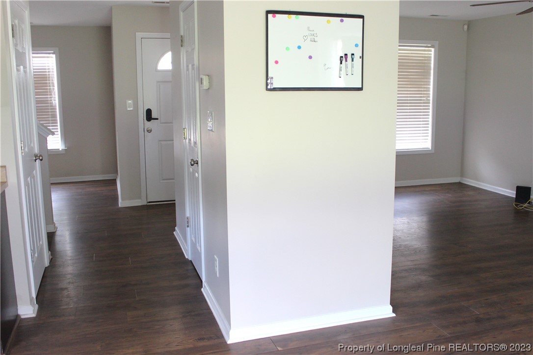 678 Cape Fear Road Raeford, NC 28376 - Photo 6 of 30 a view of a hallway with wooden floor