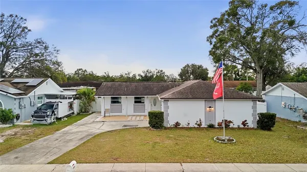 a aerial view of a house with swimming pool and sitting area