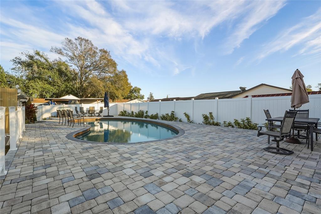 9084 Arndale Circle Tampa, FL 33615 - Photo 14 of 22 a view of a swimming pool with a lounge chair
