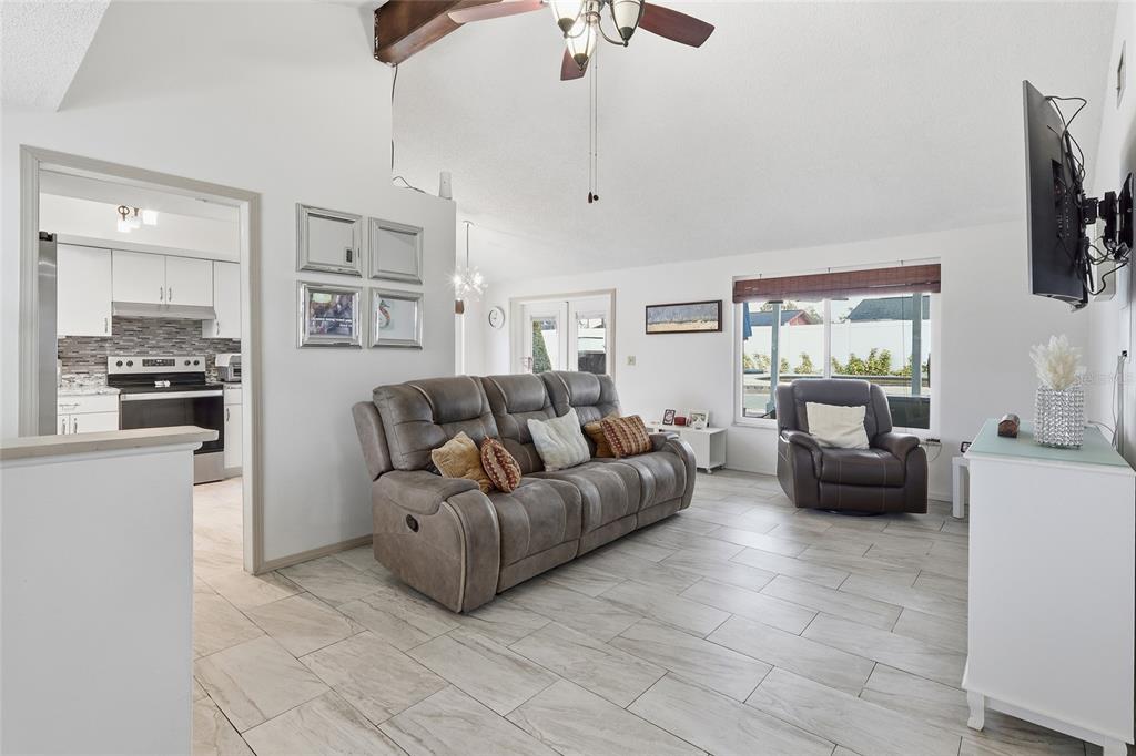 9084 Arndale Circle Tampa, FL 33615 - Photo 5 of 22 a living room with furniture and a flat screen tv