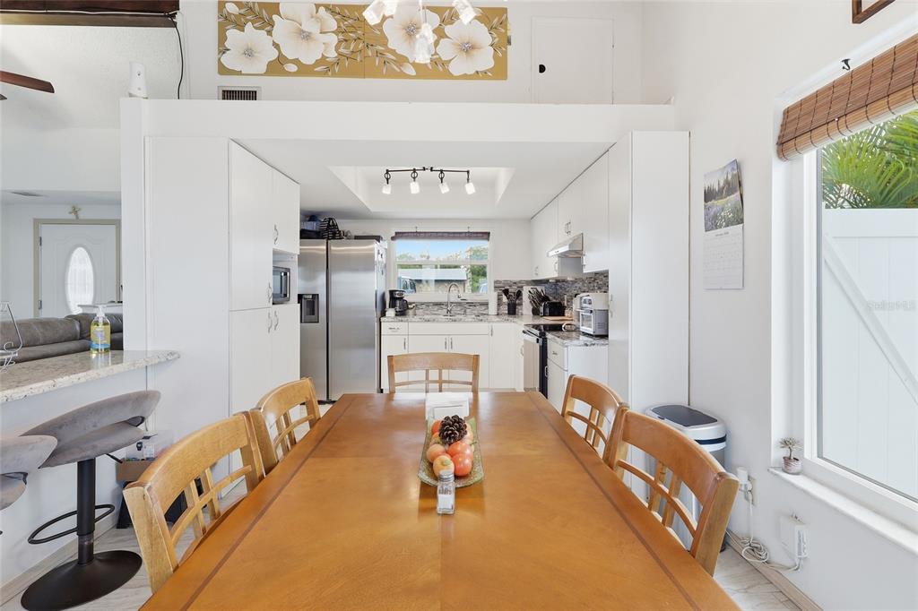 9084 Arndale Circle Tampa, FL 33615 - Photo 8 of 22 a room with stainless steel appliances kitchen island granite countertop a refrigerator and a stove