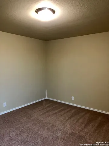 an empty room with a empty space and window