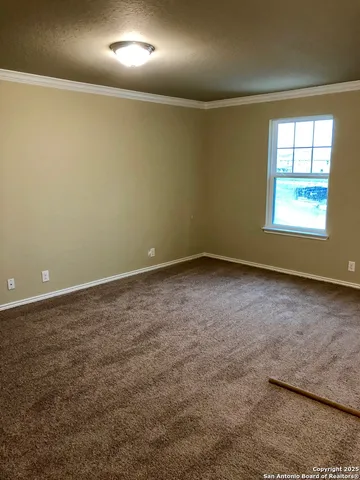 an empty room with a empty space and windows