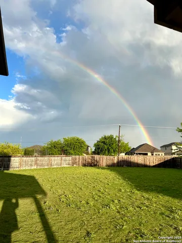 a view of a lake with lawn chairs