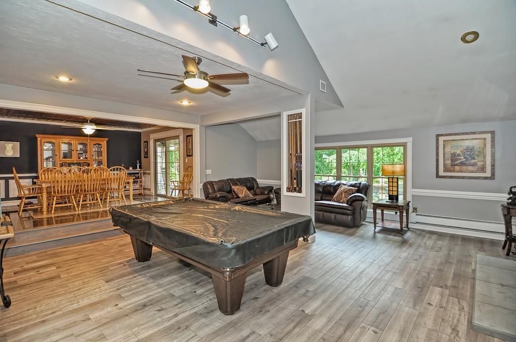 38 Johnson Road Sutton, MA 01590 - Photo 11 of 42 a living room with furniture a wooden floor and potted plant