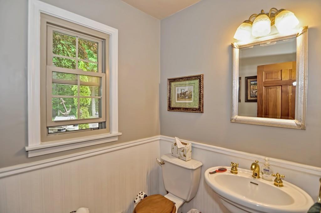 38 Johnson Road Sutton, MA 01590 - Photo 19 of 42 a bathroom with a sink mirror and a window