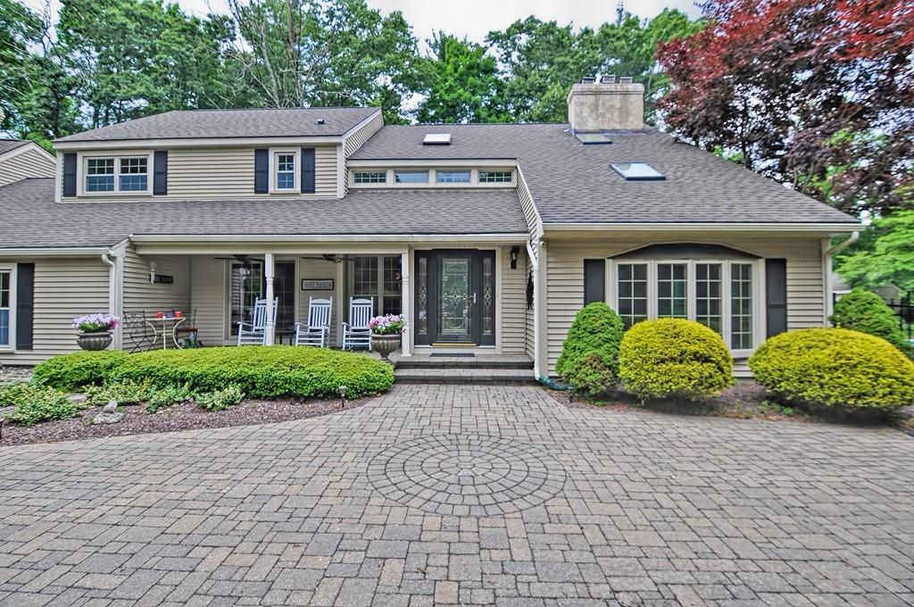 38 Johnson Road Sutton, MA 01590 - Photo 2 of 42 front view of a house with a garden