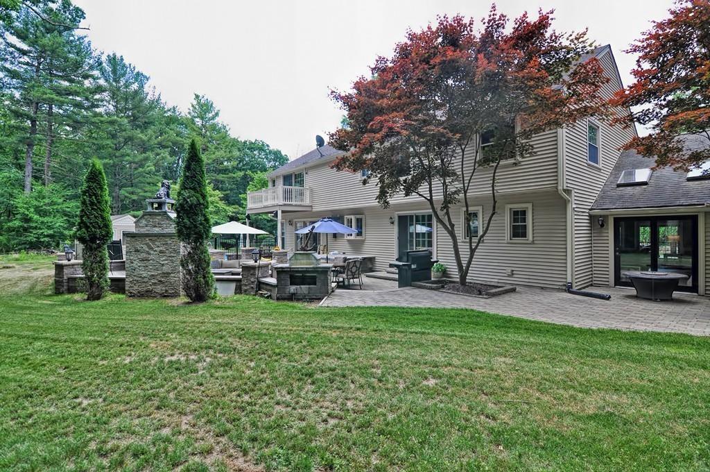 38 Johnson Road Sutton, MA 01590 - Photo 29 of 42 a view of a house with a patio and a yard