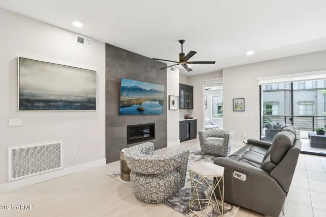 a bedroom with furniture and a fireplace