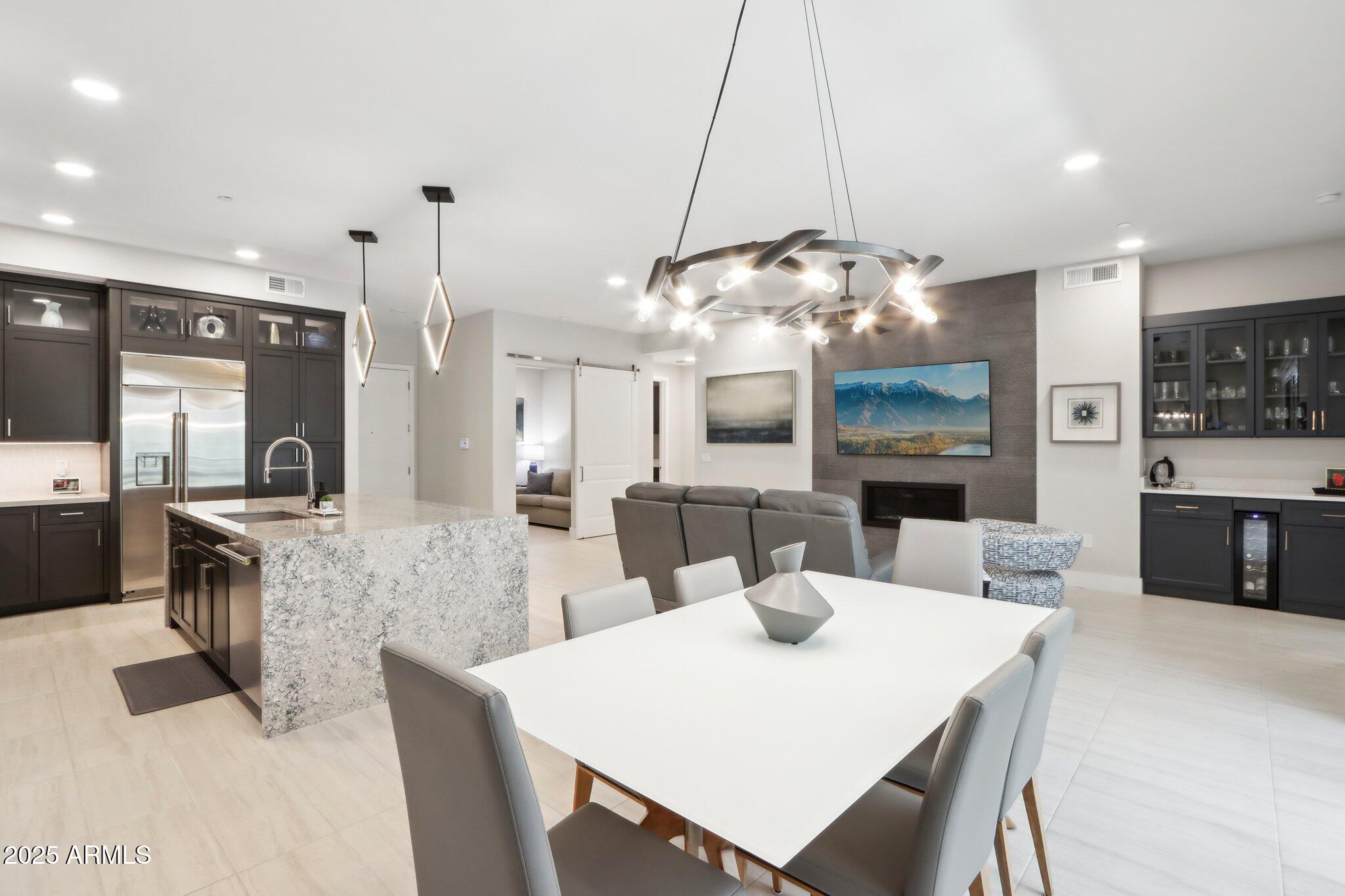 5250 East Deer Valley Drive, Unit 247 Phoenix, AZ 85054 - Photo 56 of 56 a large kitchen with a table and chairs